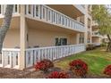 Ground-floor patio area with a garden view and sliding door entry to the home at 1200 N Shore Ne Dr # 102, St Petersburg, FL 33701