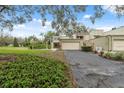 Two story townhome with large lawn and mature landscaping at 13502 Palmwood Ln # 13502, Tampa, FL 33618