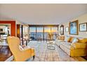 Water view from the living room featuring an area rug, modern furniture and decorations, and hardwood floors at 3301 Bayshore Blvd # 704D, Tampa, FL 33629