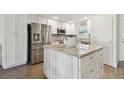Beautiful kitchen featuring an island with granite countertop and modern stainless steel appliances at 3717 46Th S Ave # 7, St Petersburg, FL 33711