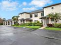 Charming townhouses feature covered carports, manicured lawns, and beautiful landscaping at 4524 Southampton Ct # 4524, Tampa, FL 33618