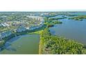 Wide aerial shot of condo complex with waterfront views, showcasing the community's desirable location at 6401 99Th N Way # 15C, St Petersburg, FL 33708