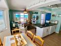 Open concept living area with dining room and ocean view at 712 Beach Trl # C, Indian Rocks Beach, FL 33785