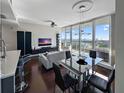 Bright living room with expansive views of the water, a dining table, and modern decor at 175 1St S St # 1204, St Petersburg, FL 33701