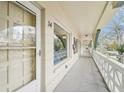 Exterior hallway featuring covered walkway with views of the building's facade at 2400 Franciscan Dr # 34, Clearwater, FL 33763