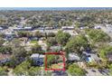 An aerial view showcasing the property's placement among the surrounding homes and lush greenery at 3607 S Hubert Ave, Tampa, FL 33629