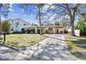 Charming single-story home featuring a well-maintained front yard and a long driveway at 3607 S Hubert Ave, Tampa, FL 33629