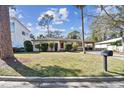 A well-kept single-Gathering home with a spacious front lawn and mature landscaping at 3607 S Hubert Ave, Tampa, FL 33629