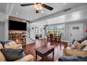 Bright living room featuring hardwood floors, modern lighting, and stylish furnishings for comfortable living at 3727 38Th N St, St Petersburg, FL 33713