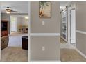 Inviting living space leading to dining area with warm neutral paint and comfortable seating at 3847 35Th S Way # 108, St Petersburg, FL 33711