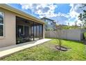 Relaxing screened-in lanai with comfortable seating, ideal for enjoying the outdoors in comfort at 4627 Tramanto Ln, Wesley Chapel, FL 33543