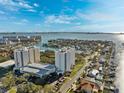 Scenic aerial view overlooking the beach and neighborhood below; perfect for water and beach lovers at 5950 Pelican Bay S Plz # Ph-2F, Gulfport, FL 33707
