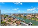 Expansive aerial view of luxury waterfront homes on canals with boat docks and stunning blue sky and waterway views at 5950 Pelican Bay S Plz # Ph-2F, Gulfport, FL 33707