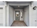 Inviting covered entryway with brick flooring, offering a warm welcome to visitors and residents at 6007 Anchorage Way, St Petersburg, FL 33712