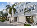 Attractive townhomes with shingle siding, two-car garages, and lush landscaping; perfect for coastal living at 6007 Anchorage Way, St Petersburg, FL 33712