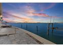 A waterfront patio with direct access to the water and incredible sunset views at 673 Boca Ciega Point N Blvd, St Petersburg, FL 33708