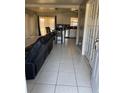 Open concept living room leading to kitchen with lots of space and exterior access at 7413 Sherren Dr, Tampa, FL 33619