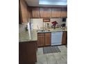 Kitchen area featuring a large sink, stainless steel appliances, and granite countertops at 852 Creekway Ct, Brandon, FL 33511