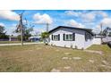 Well-maintained home featuring a lush green lawn, and neutral white paint at 3601 21St N St, St Petersburg, FL 33713