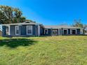 Inviting one-story home boasting an elegant entrance and a well-manicured front lawn at 5253 Sandra Dr, Weeki Wachee, FL 34607