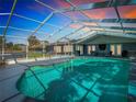 Enclosed pool area, perfect for year-round enjoyment with ample space for seating and entertaining at 5253 Sandra Dr, Weeki Wachee, FL 34607