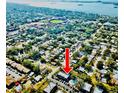 A scenic overhead view of the condo in a neighborhood near the water and a stadium at 700 Lyndhurst St # 1024, Dunedin, FL 34698