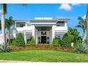 Impressive home with stately columns, meticulous landscaping, and a well-manicured lawn at 866 S Davis Blvd, Tampa, FL 33606