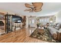 Inviting living room with wood flooring, ceiling fan, and stylish decor at 1508 Cascade Ct, Dunedin, FL 34698