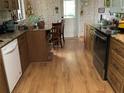 Functional kitchen featuring wood cabinets and modern appliances at 16921 Crawley Rd, Odessa, FL 33556