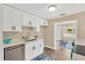 Bright kitchen features modern appliances, white cabinetry, and stylish countertop at 1910 E Chelsea St, Tampa, FL 33610