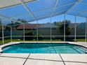 Sparkling screened-in swimming pool with a clear blue water, perfect for relaxation at 2015 Golf Manor Blvd, Valrico, FL 33596