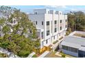 Modern townhome with multiple stories, balconies, landscaped grounds and contemporary design at 307 15Th N St, St Petersburg, FL 33705