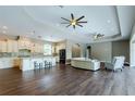 Spacious open floor plan with a kitchen island and a living area with modern furniture at 405 Tennessee Ave, Crystal Beach, FL 34681