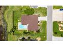 Sprawling property featuring a private pool, expansive yard, and a well-maintained home, creating an ideal outdoor living space at 811 Eagle Ln, Apollo Beach, FL 33572