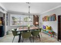 This dining room features a wood table and colorful accents at 1350 Maple Sw St, Largo, FL 33770