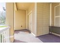 Welcoming front porch featuring a neutral color scheme and offering a warm entrance to the home at 20326 Merry Oak Ave, Tampa, FL 33647