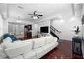 A view of an open floor plan with the living room flowing into the kitchen and dining area at 2240 Soho Bay Ct, Tampa, FL 33606