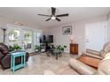 The living room features tile floors, a ceiling fan, and views of the outdoor patio at 5231 Beach Se Dr # A, St Petersburg, FL 33705