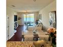 Inviting living space with lake view, seamlessly blending indoor and outdoor at 9208 Hillcroft Dr, Riverview, FL 33578