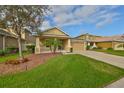 Charming single-Gathering home with a well-manicured lawn and inviting curb appeal at 9244 Bella Vita Cir, Land O Lakes, FL 34637
