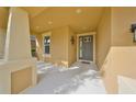 Inviting covered front porch with neutral paint, offering a welcoming entrance at 9244 Bella Vita Cir, Land O Lakes, FL 34637