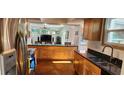 Modern kitchen boasts sleek countertops, stainless steel appliances, and ample cabinet space at 1550 Chateau Wood Dr, Clearwater, FL 33764