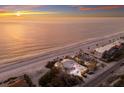 Majestic aerial of beachfront home with scenic views of ocean and beautifully maintained landscaping at 3341 Gulf Of Mexico Dr, Longboat Key, FL 34228