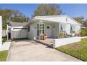Charming single-story home with a cozy porch, updated features, and inviting curb appeal at 1044 Charles St, Clearwater, FL 33755