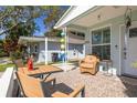 Inviting front porch with comfortable seating, decorative accents, and a welcoming entrance at 1044 Charles St, Clearwater, FL 33755