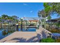 Private boat dock with a boat lift and ample space for relaxing by the waterfront at 1389 47Th Ne Ave, St Petersburg, FL 33703