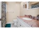 Bathroom featuring a vanity with a marble countertop at 1662 S Lake Ave # 2, Clearwater, FL 33756