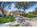 Inviting single-Gathering home with a spacious driveway and lovely green lawn at 18822 Quarry Badger Rd, Land O Lakes, FL 34638