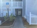 Exterior walkway with garage and stairs, featuring well maintained access and parking at 2210 Vista Del Sol Cir # 519, Lutz, FL 33558