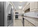 Well-equipped kitchen with stainless steel appliances and granite countertops at 410 Berwick Ave, Temple Terrace, FL 33617